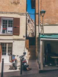 Bicycle against building in city