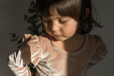 Portrait of cute girl looking at camera