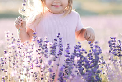 Midsection of girl in lavender field