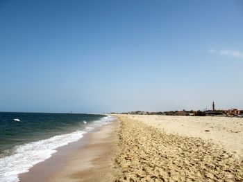 Scenic view of beach against clear sky