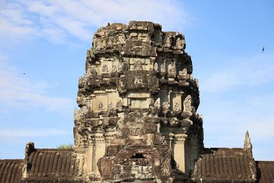 Low angle view of old ruin building against sky