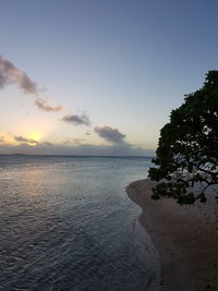 Scenic view of sea against sky at sunset