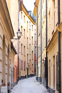 Narrow street amidst buildings in town