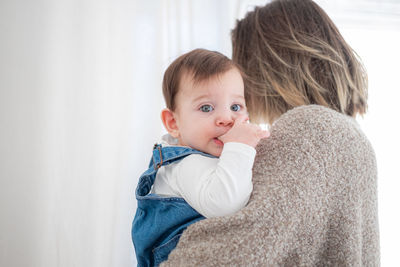 Mother with daughter at home