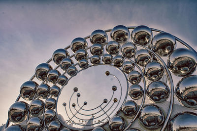 Low angle view of sculpture against sky