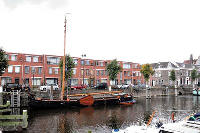 Boats moored at harbor