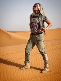 Full length of woman standing at beach