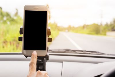 Man using mobile phone on road