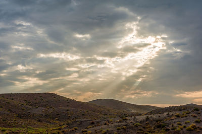 Scenic view of mountains against sky during sunset