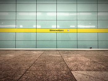 Text on wall of subway station