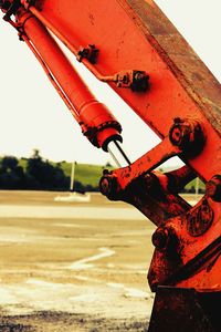 Close-up of red umbrella against the sky