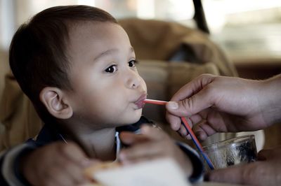 Close-up of boy drinking