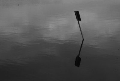 High angle view of wooden post in lake