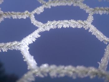 Low angle view of vapor trail in snow