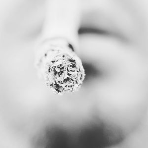 Close-up of cigarette against black background