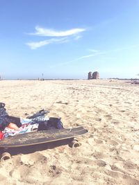 Scenic view of beach against sky on sunny day