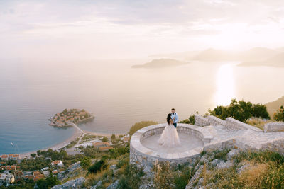 High angle view of man in sea against sky