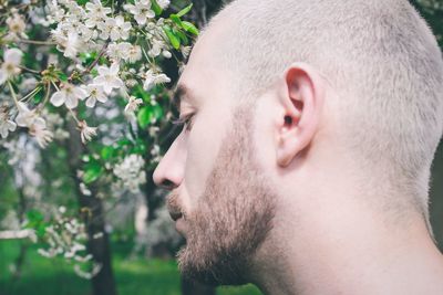 Close-up portrait of man with eyes closed