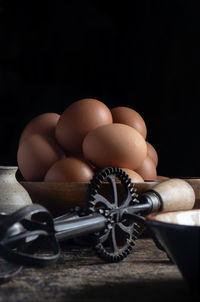 Organic chicken eggs vertical with a iron whisk, room for text