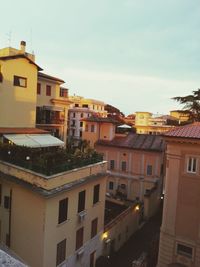 Residential buildings in city against sky