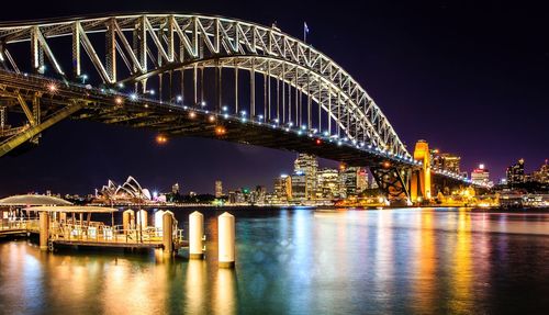 Illuminated sydney harbor bridge at night