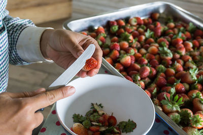 Midsection of woman preparing food