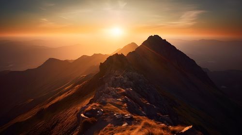 Scenic view of mountains against sky during sunset