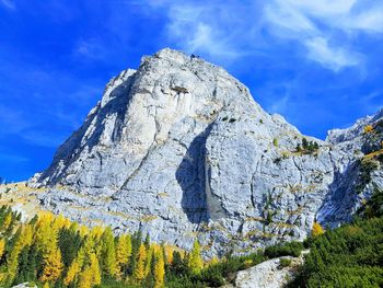 Low angle view of rock formations against sky