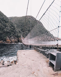 Bridge over river against sky