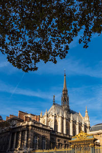 Low angle view of buildings against blue sky