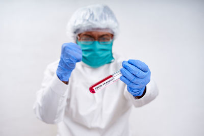 Full length of a man holding hands over white background