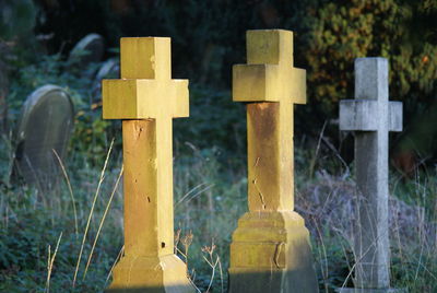 Close-up of tombstones at cemetery