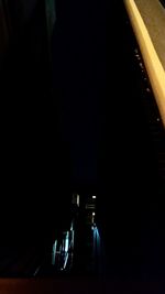 Empty chairs in dark room