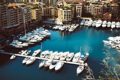 High angle view of boats moored in city