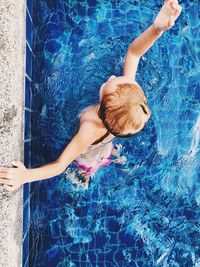 High angle view of girl swimming in pool