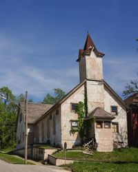 Low angle view of built structure against blue sky