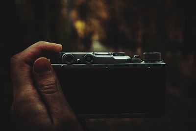 Close-up of person holding camera