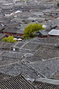 High angle view of tree and building in city