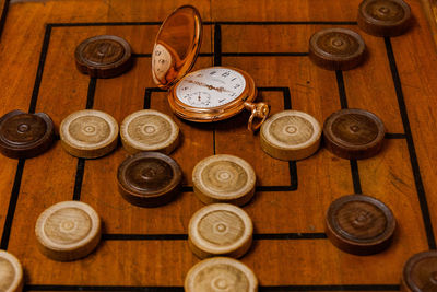 High angle view of clock on table