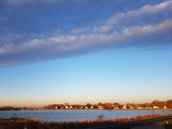 Scenic view of lake against sky during winter