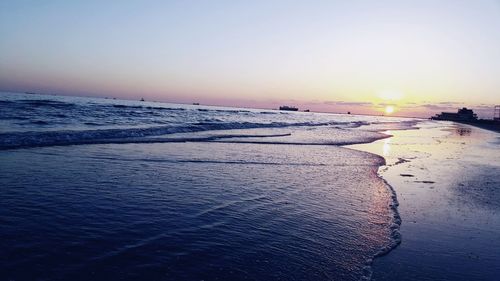 Scenic view of sea against clear sky during sunset