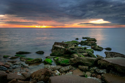 Scenic view of sea against sky at sunset