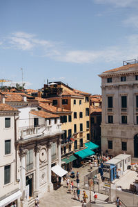 Buildings in city against sky