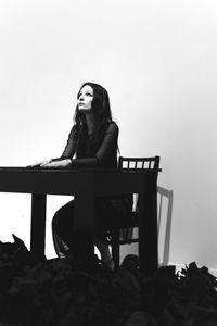 Young woman sitting on chair