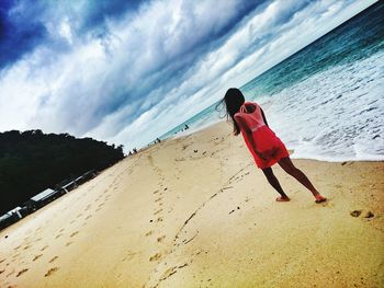 Woman standing on beach