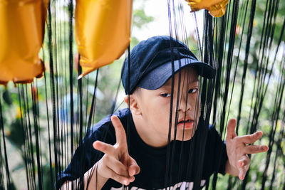 An autism boy playing with birthday party decoration