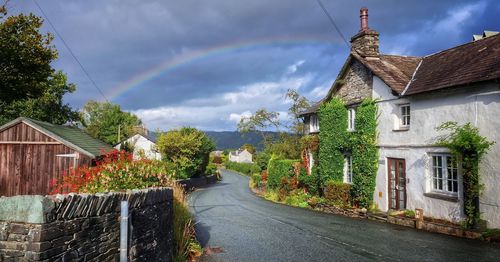 Rainbow over country cottage