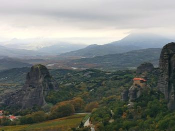 Scenic view of mountains against cloudy sky