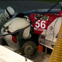 Close-up of red car on road