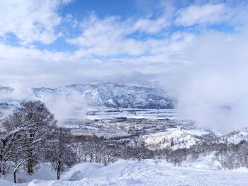 Scenic view of snowcapped mountains against sky